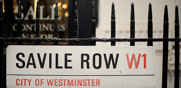 A street sign indicating Savile Row is pictured in central London, on February 12, 2010. McQueen's cut his teeth as a tailor in Savile Row, where legend has it that he left his distinctive mark -- in the form of hand-written obscenities -- in the lining of a jacket for Prince Charles, the heir to the British throne. McQueen was found dead at his London home Thursday after apparently committing suicide barely a week after his mother died, police and reports said. AFP PHOTO/BEN STANSALL (Photo credit should read BEN STANSALL/AFP/Getty Images)