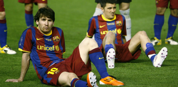 FC Barcelona's Lionel Messi from Argentina, left, and David Villa sit on the ground after Real Madrid defeated FC Barcelomna 1-0 during the final of the Copa del Rey soccer match at the Mestalla stadium in Valencia, Spain Wednesday April 20, 2011. (AP Photo/Fernando Bustamante)