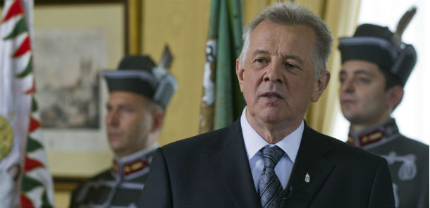 Hungarian President Pal Schmitt addresses the nation in a televised message after he signed the new constitution of Hungary in the presidential Alexander Palace in Budapest, Hungary, Monday, April 25, 2011. The constitution was passed by the Parliament Monday, April, 18, 2011, with the oppositional Hungarian Socialist Party and the green liberal Politics Can Be Different Party boycotting the vote. The new constitution will take effect as of Jan. 1, 2012. (AP Photo/MTI, Tibor Illyes, Pool)