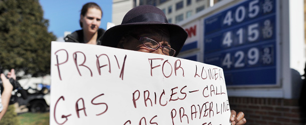Demonstrators take part in a pray vigil for lower gasoline price in front of a service station in Washington, DC, on February 23, 2012. US President Barack Obama will try to head off Republican criticism over rising gasoline prices Thursday, setting out how the United States should address its voracious appetite for energy. Visiting the hard-hit election battleground of Florida, Obama will address concerns about rising gasoline prices, which have jumped 16 percent in a year in the Sunshine State, providing campaign fodder for his Republican foes. AFP Photo/Jewel Samad (Photo credit should read JEWEL SAMAD/AFP/Getty Images)