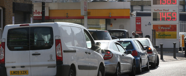 LONDON, ENGLAND - MARCH 29: Cars queue up at a petrol station near Hackney on March 29, 2012 in London, England. Government ministers appear to have caused sporadic panic buying of fuel after suggesting that motorists should store petrol in jerry cans at home. Tanker divers have announced that they will strike over pay and conditions, although they have not yet given a date. (Photo by Peter Macdiarmid/Getty Images)