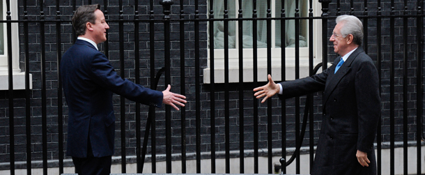 British Prime Minister David Cameron (L) welcomes Italian Prime Minister Mario Monti to 10 Downing Street in London, on January 18, 2012. Monti is also expected to visit the London Stock Exchange later Wednesday. AFP PHOTO/CARL COURT (Photo credit should read CARL COURT/AFP/Getty Images)