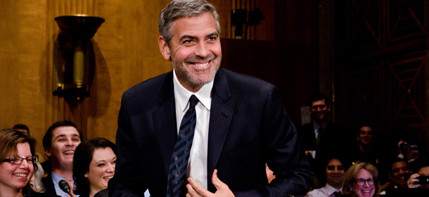 WASHINGTON, DC - MARCH 14: George Clooney smiles as he testifies at the Senate Foreign Relations Sudan and South Sudan: Independence and Insecurity hearing at the Dirksen Senate Office Building on March 14, 2012 in Washington, DC. (Photo by Kris Connor/Getty Images)