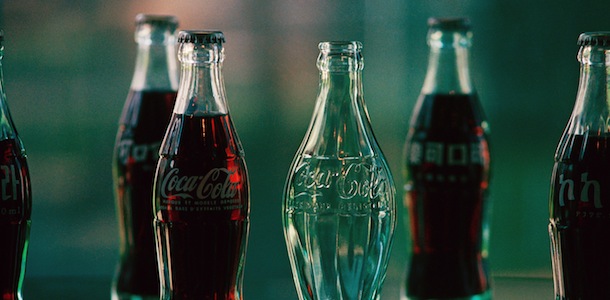 The bottle used by Coca-Cola for export to France, stands by the prototype of the very first Coke bottle shown May 5, 1986 in Atlanta, Ga. (AP Photo/Joe Holloway, Jr.)