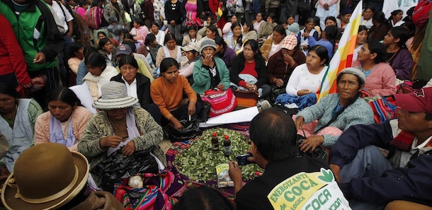 Coca growers sit around coca leaves during the so-called "National day of coca leaf-chewing" in La Paz, Bolivia, Monday March 12, 2012. Bolivia held a national campaign in defense of chewing the coca leaf, known locally as "acullico," parallel to a request for the legalization of this practice which Bolivia's President Evo Morales will make at a UN meeting in Vienna, Austria. (AP Photo/Juan Karita)