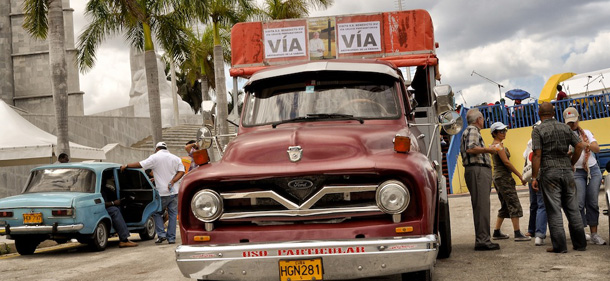 Picture of a truck with posters regarding the upcoming visit of Pope Benedict XVI, taken in Havana on March 21, 2012. Pope Benedict XVI makes his first trip to Spanish-speaking Latin America this week in a bid to revive the Catholic faith in the region, with visits to Mexico and Cuba. The pope hopes to encourage religious fervor in the island nation where he is scheduled to arrive on March 26, and a big turnout is expected from the Catholic community -- around 10 percent of the population -- at masses in Santiago de Cuba and Havana. AFP PHOTO/STR (Photo credit should read STR/AFP/Getty Images)