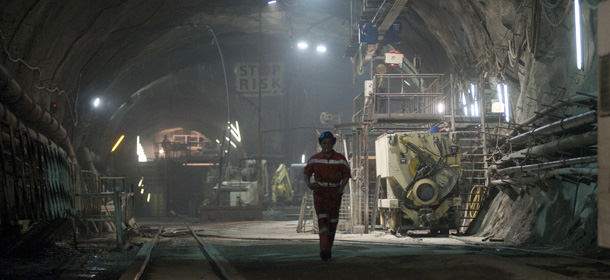 A worker walks along the 57-kilometre (35-mile) railway tunnel under construction in the Alps at Sedrun on May 6, 2009. The new St. Gotthard tunnel is expected to be the world's longest when completed. The 18.6 billion Swiss franc (11 billion euros, 15.7 billion dollars) Alptransit project, which is now due to be completed in 2016, is meant to increase rail capacity for freight and passengers through the Alps and between northern Europe and Italy. AFP PHOTO/SEBASTIEN BOZON (Photo credit should read SEBASTIEN BOZON/AFP/Getty Images)