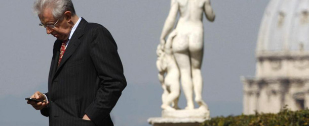 Italian premier Mario Monti checks his phone as St. Peter's Basilica dome is seen in background, as he waits for Malta president George Abela prior to their meeting at Rome's Villa Doria Pamphjli, Tuesday, March 20, 2012. (AP Photo/Pier Paolo Cito)