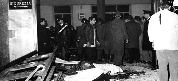 Bodies are covered by sheets after a bomb explosion at Milan's Banca dell' Agricoltura bank in Piazza Fontana in this 1969 picture. People clapped in a Milan court after president Luigi Martino read the sentence for the bombing that left 16 people dead and opened a two-decade wave of terrorism in Italy, Saturday June 30, 2001. Delfo Zorzi, Carlo Maria Maggi and Giancarlo Rognoni were sentenced to life imprisonment. (AP Photo)