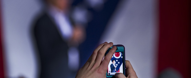 A supporter takes a picture with his cell phone of Republican presidential candidate Mitt Romney as he prepares to speak at a rally in Zanesville, Ohio, March 5, 2012, ahead of voting on Super Tuesday. AFP PHOTO/Jim Watson (Photo credit should read JIM WATSON/AFP/Getty Images)