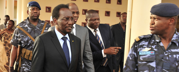 Malian Parliament Speaker Dioncounda Traore (L) is followed by Burkina Faso Foreign Minister Djibrill Bssole (3rd R) on April 7, 2012 upon his arrival at the Bamako airport from Burkina Faso. World powers on April 7 welcomed a decision by Mali's military junta to step aside ahead of elections, but there was fresh condemnation of Tuareg rebels declaring independence in the north. The junior officers, who seized power lon March 22, agreed on April 6 with West African bloc ECOWAS to give up power in return for an amnesty deal and a lifting of sanctions the regional body had imposed on landlocked Mali. Under the agreement, the new interim president will be Traore, ruling with a transitional government until elections are held. The junta agreed to a timetable for a return to constitutional rule and elections following their ouster of President Amadou Toumani Toure. AFP PHOTO / ISSOUF SANOGO (Photo credit should read ISSOUF SANOGO/AFP/Getty Images)