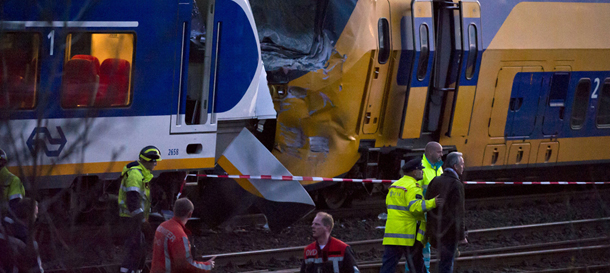 Care providers and policemen walk on the site where two trains collided between train stations Amsterdam-Sloterdijk and Amsterdam-Centraal in Amsterdam, on April 21, 2012. At least 60 people were injured, up to 20 of them seriously, in a two-train collision today outside Amsterdam. AFP PHOTO/ ANP/ FRANK VAN BEEK ***NETHERLANDS OUT*** (Photo credit should read FRANK VAN BEEK/AFP/Getty Images)