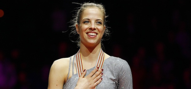 Carolina Kostner of Italy, gold medal winner in the Women Free skating reacts during the Italian anthem at the ISU 2012 World Figure Skating Championships in Nice, southern France, Saturday, March 31, 2012. (AP Photo/ Francois Mori)