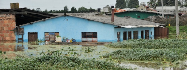 Picture of a house in the flooded municipality of Cota, outskirts of Bogota, Colombia, on April 18, 2012. Up to now, the first rainy season of the year in Colombia --which began on March 15-- has cost the lives of 19 people and left 60,684 homeless, according to the National Unit for Risk Management. AFP PHOTO/Guillermo LEGARIA (Photo credit should read GUILLERMO LEGARIA/AFP/Getty Images)