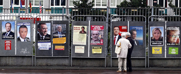 People look at electoral posters depicting the presidential candidates in Lille, northern France ,Tuesday, April 10, 2012. The presidential elections will take place on April 22 and May 6, 2012. (AP Photo/Michel Spingler)