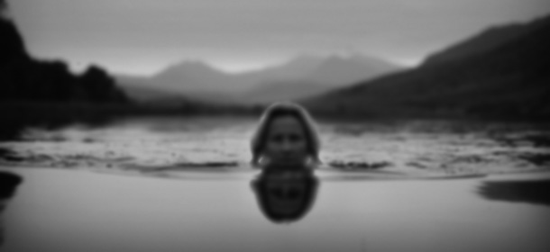 CAPEL CURIG, UNITED KINGDOM - JUNE 30: Lady Alice Douglas swims in Llyn Mymbyr in the shadow of the Snowdon Horseshoe in North Wales on June 30, 2009 in Capel Curig, United Kingdom. Lady Alice has been swimming in lakes and rivers since she was a child and often takes a plunge with her children in the wild waters around her home in the Snowdonia foothills. Swimming in wild rivers and lakes is gaining in popularity across Britain with maps and books detailing the locations of the wildest outdoor swims. (Photo by Christopher Furlong/Getty Images)