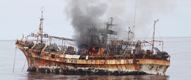 In this photo provided by the U.S. Coast Guard, a plume of smoke rises from the derelict Japanese ship Ryou-Un Maru after it was hit by canon fire by a U.S. Coast Guard cutter on Thursday, April 5, 2012, in the Gulf of Alaska. The Coast Guard decided to sink the ship dislodged by last year's tsunami because it was a threat to maritime traffic and could have an environmental impact if it grounded. (AP Photo/U.S. Coast Guard)