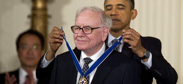 US President Barack Obama awards the 2010 Medal of Freedom to investor, industrialist and philanthropist Warren Buffett during a ceremony at the White House in Washington, DC, February 15, 2011. Often called the Ã¬legendary investor Warren Buffett,Ã® he is the primary shareholder, Chairman and CEO of Berkshire Hathaway. Mr. Buffett has pledged that all of his shares in Berkshire Hathaway Ã± about 99 percent of his net worth Ã± will be given to philanthropic endeavors. He is a co-founder of The Giving Pledge, an organization that encourages wealthy Americans to devote at least 50 percent of their net worth to philanthropy. AFP PHOTO/Jim WATSON (Photo credit should read JIM WATSON/AFP/Getty Images)