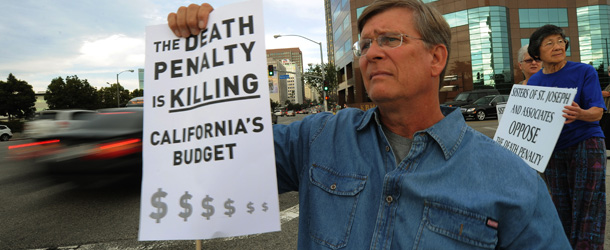 Anti-death penalty campaigner Alan Toy joins other protesters as they stage a demonstration and march outside the Federal Bulding in Los Angeles on September 28, 2010. Anti-death penalty campaigners slammed California's bid to resume executions this week after a five-year hiatus, as a killer's fate remained uncertain amid a shortage of a key drug. Albert Greenwood Brown, convicted of the 1980 abduction and rape of a 15-year-old schoolgirl, is scheduled to die at 9:00 pm Thursday (0400 GMT Friday) after a legal delay ordered by Governor Arnold Schwarzenegger. But the execution, due to take place at San Quentin prison, north of San Francisco, is also in doubt as it would come hours before the expiration date of the jail's remaining stock of a key lethal drug used in the death chamber. AFP PHOTO/Mark RALSTON (Photo credit should read MARK RALSTON/AFP/Getty Images)
