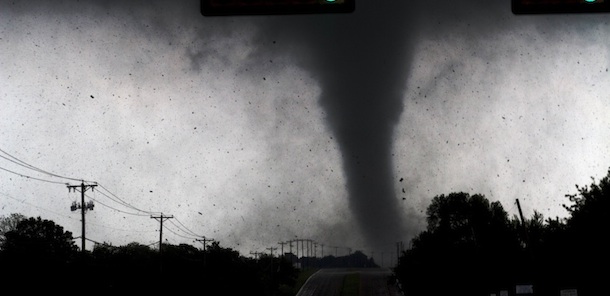 A tornado touches down in Lancaster, Texas south of Dallas on Tuesday, April 3, 2012. Tornadoes tore through the Dallas area Tuesday, peeling roofs off homes, tossing big-rig trucks into the air and leaving flattened tractor trailers strewn along highways and parking lots. (AP Photo/The Dallas Morning News, Parrish Velasco) MANDATORY CREDIT; MAGS OUT; TV OUT; INTERNET OUT; AP MEMBERS ONLY