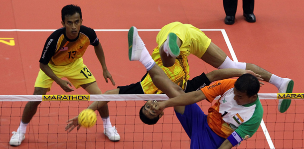 SINGAPORE - MAY 04: Mohd Fadzli Bin Muhd. Roslan of Malaysia returns a shot to India during their men's match on day two of the ISTAF Super Series at ITE Campus on May 4, 2012 in Singapore. (Photo by Nicky Loh/Getty Images for UFA Sports)