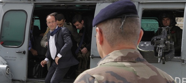 French President Francois Hollande arrives at Forward Operating Base (FOB) Nijrab, on May 25, 2012 in Kapisa, where most French troops are stationed in Afghanistan. President Francois Hollande said Friday that France would coordinate with NATO allies the withdrawal of its combat troops from Afghanistan. AFP PHOTO / POOL / JOEL SAGET (Photo credit should read JOEL SAGET/AFP/GettyImages)