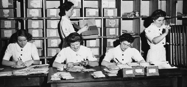 The mail office, the only one of its kind in America, is headquarters for all British military mail coming to America which is sorted and distributed from this point, and staffed by Wrens, WomenÃ­s Royal Naval Service. From left to right: Wren Jean Wheeler, of London; Wren May McLeod, of Edinburgh; Petty Officer Janet McCrow of Edinburgh; Wren Doris Timms, of London, and Wren Susan Masson, of Aberdeen at work in the British mail Fleet office in New York on Aug. 13, 1943. (AP Photo)