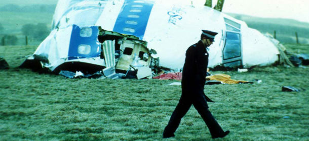 FILE - In this Dec. 1988 file photo, a police officer walks past the wreckage in Lockerbie, Scotland of Pan Am Flight 103 from London to New York. The Dec. 21, 1988 explosion would quickly transform the Scottish town into a byword for international terror. Now it is being remembered again because of the 2011 conflict in Libya, the country that accepted responsibility for blowing up Pan Am Flight 103. (AP Photo)