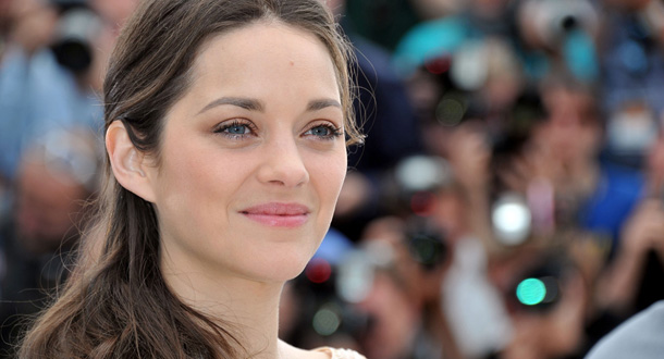 CANNES, FRANCE - MAY 17: Actress Marion Cotillard poses at the "De Rouille et D'os" Photocall during the 65th Annual Cannes Film Festival at Palais des Festivals on May 17, 2012 in Cannes, France. (Photo by Pascal Le Segretain/Getty Images)