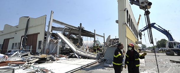 Italian firefighters search the debris of a collapsed factory in Mirandola, northern Italy, Tuesday, May 29, 2012. A magnitude 5.8 earthquake struck the same area of northern Italy stricken by another fatal tremor on May 20. (AP Photo/Marco Vasini)