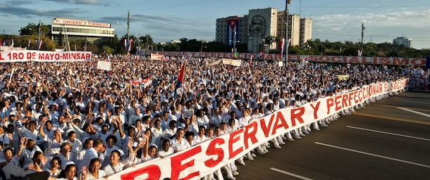 Thousands of Cubans march under the slogan "Preserve and Perfect Socialism", at Revolution Square in Havana during Labour Day on May 1, 2012. AFP PHOTO/ADALBERTO ROQUE (Photo credit should read ADALBERTO ROQUE/AFP/GettyImages)