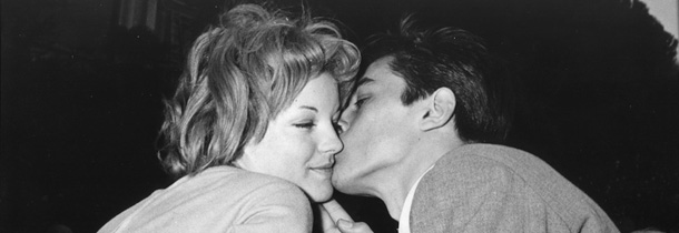 Romy Schneider with Alain Delon at the villa of Herbert Blatzheim, Schneider's adoptive father, in Morcote near Lugano after their engagement, March 22, 1955. (AP-photo)