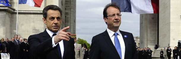 France's outgoing president Nicolas Sarkozy (L) and president-elect Francois Hollande (R) take part in a ceremony marking the 67th anniversary of the Allied victory over Nazi Germany in World War II, on May 8, 2012 at the Arc de Triomphe in Paris. AFP PHOTO LIONEL BONAVENTURE (Photo credit should read LIONEL BONAVENTURE/AFP/GettyImages)