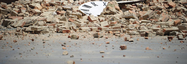 The clock of the Mirandola's cathedral is damaged after an earthquake on May 29, 2012. As many as 10 people were reported killed when a strong earthquake rocked northeastern Italy on Tuesday, just days after another quake in the same region wrought death and destruction. AFP PHOTO / OLIVIER MORIN (Photo credit should read OLIVIER MORIN/AFP/GettyImages)