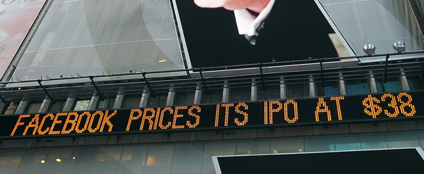 NEW YORK, NY - MAY 17: An image of Donald Trump is seen above a message board that is announcing Facebook's IPO price in Times Square on May 17, 2012 in New York City. Facebook will list their IPO on Nasdaq on Friday morning with an opening price of $38 per share. (Photo by Justin Sullivan/Getty Images)