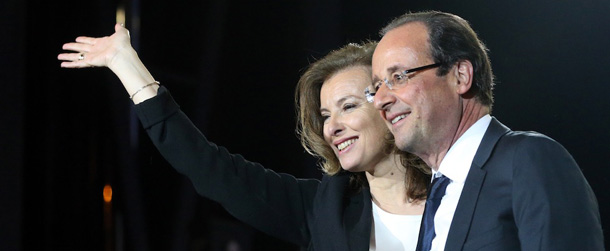 France's Socialist Party (PS) newly elected president Francois Hollande and companion Valerie Trierweiler celebrate at the Place de la Bastille in Paris on May 7, 2012 after the announcement of the first official results of the French presidential second round. Socialist candidate Francois Hollande won the French presidential election on Sunday with between 52 and 53 percent of the vote, ousting right-wing incumbent Nicolas Sarkozy, according to estimates. AFP PHOTO / THOMAS COEX (Photo credit should read THOMAS COEX/AFP/GettyImages)
