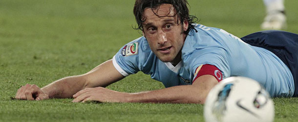 FILE -- In this May 2, 2012 file photo, Lazio's Stefano Mauri eyes the ball during a Serie A soccer match between Lazio and Siena in Rome. Mauri was among more than twelve arrested as part of a wide-ranging investigatio into max-fixing in football, Monday, May 28, 2012. Italian authorities also swept through the Italy national team training site near Florence, and are investigating Italy and Zenit St Petersburg defender Domenico Criscito a week before the national team leaves for the European Championship in Poland and Ukraine, and the coach of Italian champion Juventus, Antonio Conte for his alleged wrongdoing while coach of Siena. (AP Photo/Gregorio Borgia)