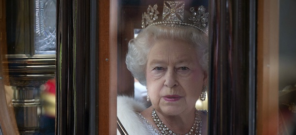 Britain's Queen Elizabeth II looks through the window of the Australian State Coach en route at the Palace of Westminster, home to the Houses of Parliament, London Wednesday May 9, 2012. (AP Photo/Carl Court, Pool)