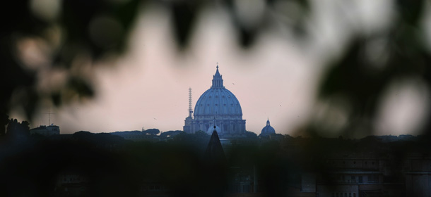 A view of the sunset over St Peter's basilica on April 29, 2011 in Rome. Late Pope John Paul II will be honoured on May 1 at a solemn beatification ceremony in Saint Peter's basilica that will give the late pontiff "blessed" status for the world's 1.1 billion Catholics and put him on the path towards full sainthood. AFP PHOTO / ALBERTO PIZZOLI (Photo credit should read ALBERTO PIZZOLI/AFP/GettyImages)