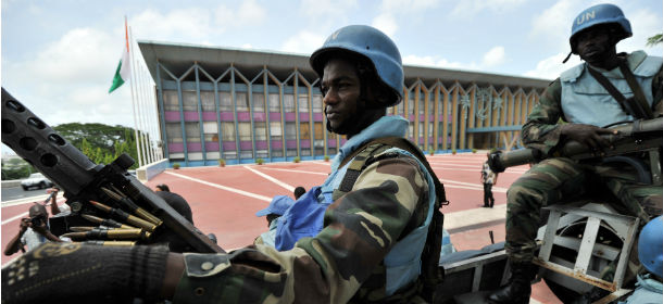 United Nations Operation in CÃ´te d'Ivoire (UNOCI) Senegalese soldiers guard the presidential palace during a visit by Ivorian President Alassane Ouattara in Abidjan on April 28, 2011. Ivory Coast's new President Alassane Ouattara made his first visit to the presidential palace since taking power after the toppling of strongman Laurent Gbagbo. AFP PHOTO / ISSOUF SANOGO (Photo credit should read ISSOUF SANOGO/AFP/Getty Images)