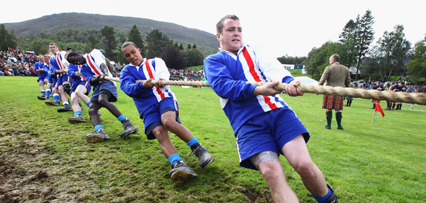 BRAEMAR, SCOTLAND - SEPTEMBER 03: Competitors take part in the Tug-o-war during the Braemar Highland Games at The Princess Royal and Duke of Fife Memorial Park on September 3, 2011 in Braemar, Scotland. The Braemar Gathering is the most famous of the Highland Games and is known worldwide. Each year thousands of visitors descend on this small Scottish village on the first Saturday in September to watch one of the more colorful Scottish traditions. The Gathering has a long history and in its modern form it stretches back nearly 200 years. (Photo by Jeff J Mitchell/Getty Images)