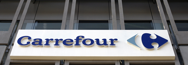 The logo of French Carrefour, the world's second biggest retailer, is pictured at the entrance of the headquarters, on March 8, 2012 in Boulogne-Billancourt, outside Paris. AFP PHOTO THOMAS SAMSON (Photo credit should read THOMAS SAMSON/AFP/Getty Images)