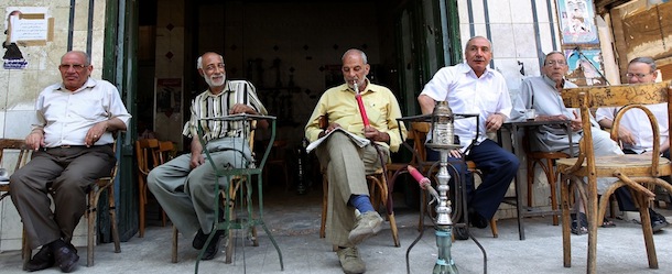 Egyptians sit outside a cafe in Cairo on June 13, 2012, days before Egyptians head to the polls in the second round of voting for the country's president. AFP PHOTO/MARWAN NAAMANI (Photo credit should read MARWAN NAAMANI/AFP/GettyImages)
