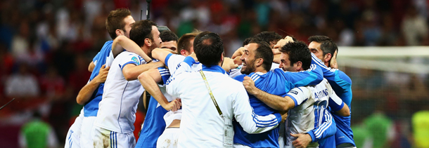 WARSAW, POLAND - JUNE 16: The Greece team celebrate victory and progress to the quarter finals during the UEFA EURO 2012 group A match between Greece and Russia at The National Stadium on June 16, 2012 in Warsaw, Poland. (Photo by Shaun Botterill/Getty Images)