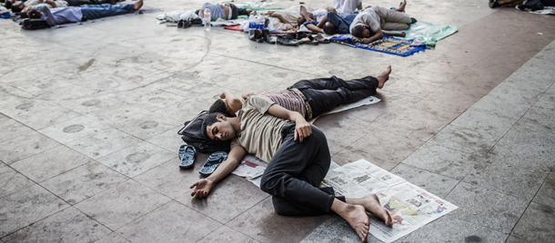 CAIRO, EGYPT - JUNE 23: Supporters of Mohamed Morsi, the Muslim Brotherhood candidate, sleep as they camp overnight in protest against Egypt's military rulers in Tahrir Square on June 23, 2012 in Cairo, Egypt. Egyptian election officials have postponed the announcement of a winner in last weekend's presidential run-off, stating they needed more time to evaluate charges of electoral abuse that could affect who becomes the country's next president. (Photo by Daniel Berehulak /Getty Images)