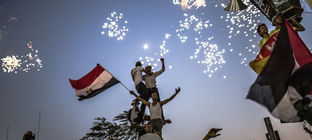 CAIRO, EGYPT - JUNE 24: Egyptians celebrate the election of their new president Mohamad Morsi in Tahrir Square on June 24, 2012 in Cairo, Egypt. Official election results today confirmed that Mohamed Morsi to be the next president of Egypt. Morsi received over 13 million or 51.7% of the votes, while his main rival, former Prime Minister Ahmed Shafiq, received 48.27 percent. (Photo by Daniel Berehulak/Getty Images)