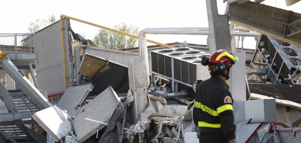 A firefighter looks for three workers tah are reportedly missing at the Haemotronic factory in Medolla, northern Italy, Tuesday, May 29, 2012. A magnitude 5.8 earthquake struck the same area of northern Italy stricken by another fatal tremor on May 20. (AP Photo/Luca Bruno)