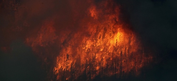 Fire explodes on the south side of Poudre Canyon as the High Park wildfire burns west of Fort Collins, Colo., on Thursday, June 14, 2012. The wildfire started Saturday and has burned over 50,000 acres. (AP Photo/Ed Andrieski)