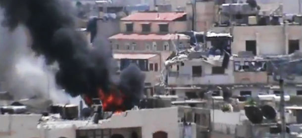 nella foto, Homs, in Siria (AP/Shaam News Network via AP video)