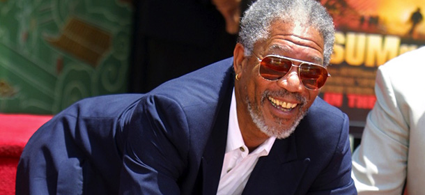 LOS ANGELES, UNITED STATES: US actor Morgan Freeman places his hands in cement in front of Grauman's Chinese Theater in the Hollywood area of Los Angeles 05 June 2002. Freeman, winner of a Golden Globe award for his role in "Driving Miss Daisy" as well as a three-time Oscar nominee, joined a host of other celebrities who have had their hand and footprints immortilized in frount of the Hollywood landmark. AFP Photo/Lee Celano (Photo credit should read LEE CELANO/AFP/Getty Images)